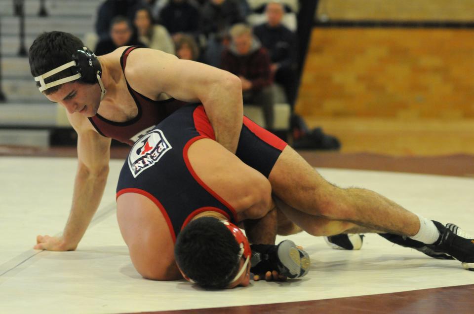 While co-captain J.P. O’Connor may have been the face of the Harvard program, co-captain Louis Caputo, above, also earned himself a permanent place in Harvard wrestling lore, amassing four NCAA appearances and 126 wins over the span of his career—good for the third most in the program’s history.   