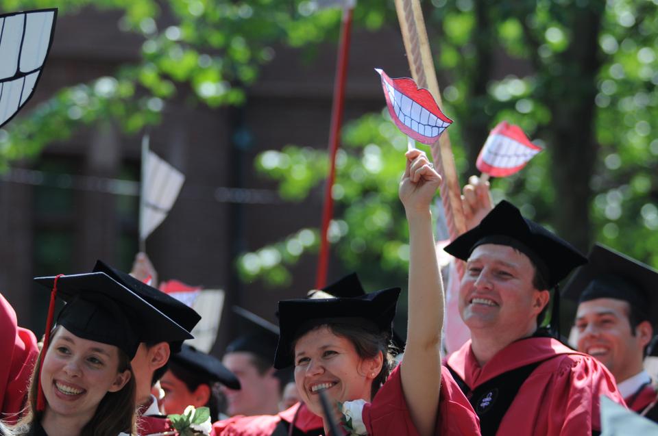 Graduates are all smiles during the conferring of degrees on candidates from the Harvard School of Dental Medicine.