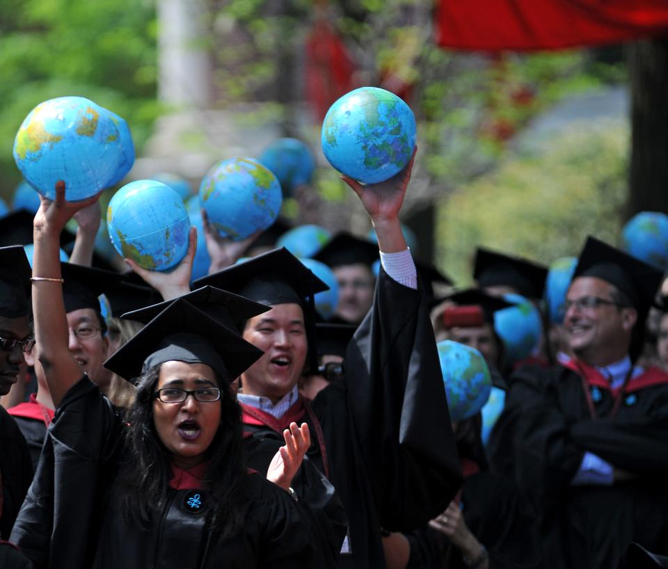 Graduates of the John F. Kennedy School of Government rejoice in Tercentenary Theatre during the 359th Commencement.