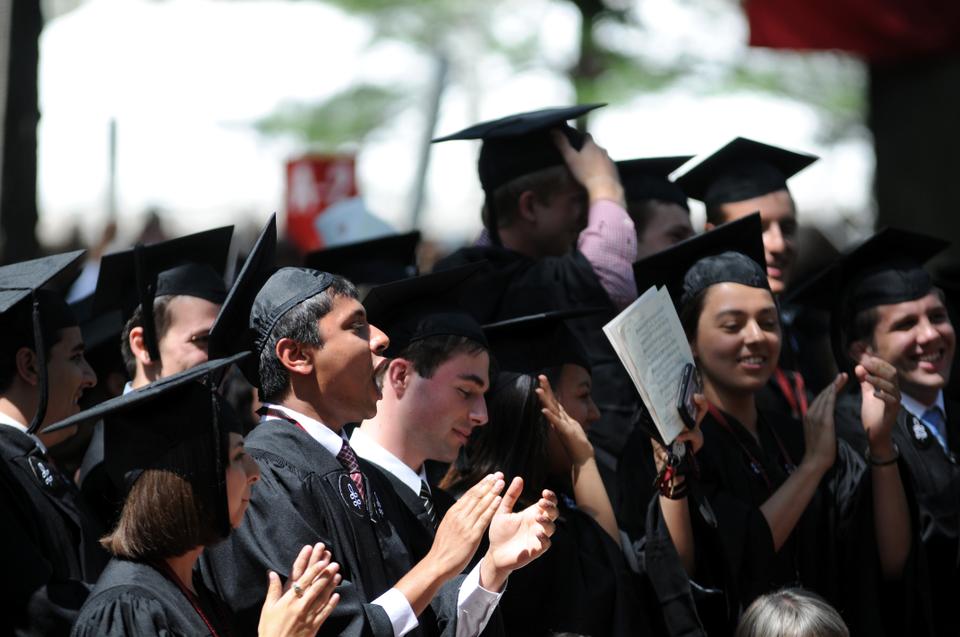 Members of the Senior Class of 2010 cheer as President Drew G. Faust confers degrees on candidates from Harvard College.