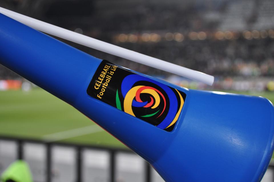 A fan's vuvuzela horn bears a sticker with the words "Celebrate. Football is Life" at a match between France and Mexico during the 2010 World Cup. 
