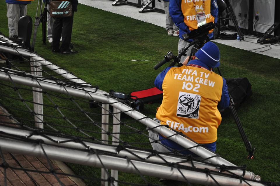 A television crew member sets up in the sidelines during a World Cup Game between France and Mexico on June 17th at the Peter Mokaba Stadium in Polokwane, South Africa.