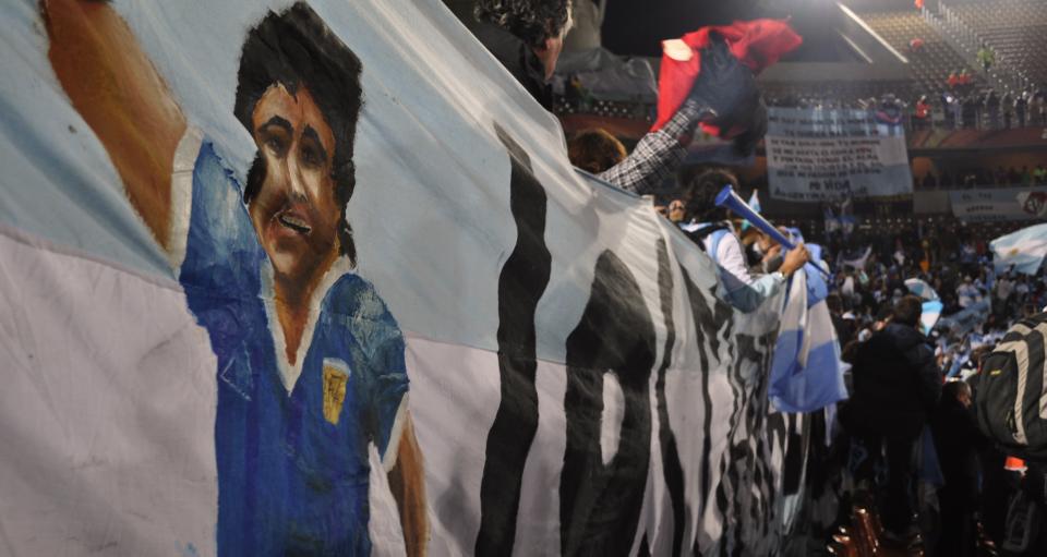 Fans wave a banner that pays tribute to Argentinian soccer hero Diego Maradona while the Argentinian national team plays against Greece on June 22nd at the Peter Mokaba Stadium in Polokwane, South Africa. Argentina ended the night victorious over Greece and made it into the top eight during the 2010 World Cup before falling to Germany. 