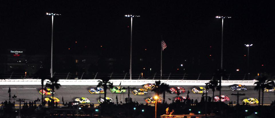 Jeff Gordon leads the pack from the outside as drivers fight for the win in the Coke Zero 400 on Saturday, July 3.