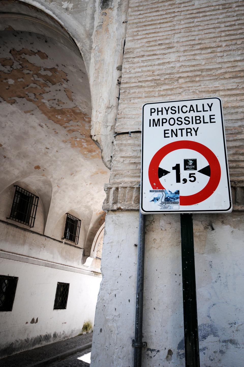 A sign warns large trucks not to enter this particular roadway in Granada, Spain.