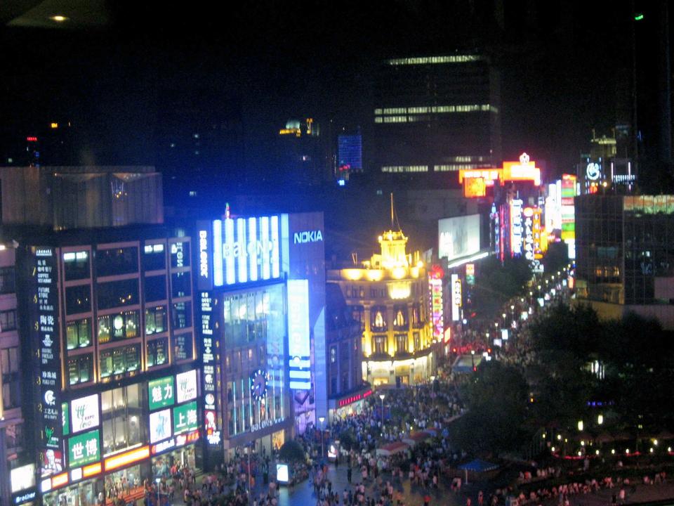 Nanjing Road East, a glitzy pedestrian walkway crowded with shops, restaurants, and tourists. 