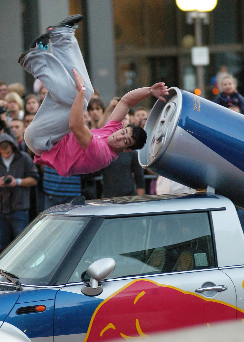 Cory DeMeyers flips over a car as he competes in the Red Bull Art of Motion in Boston on Friday night. The event mixes the disciplines of parkour and free running in a kind of urban acrobatics.