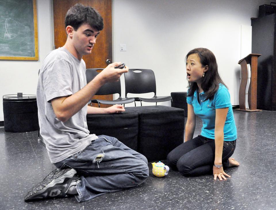 Daniel J. Giles ’13 shares a pretend playdate with Vanessa B. Koo ’12 in “Mr. Marmalade.”