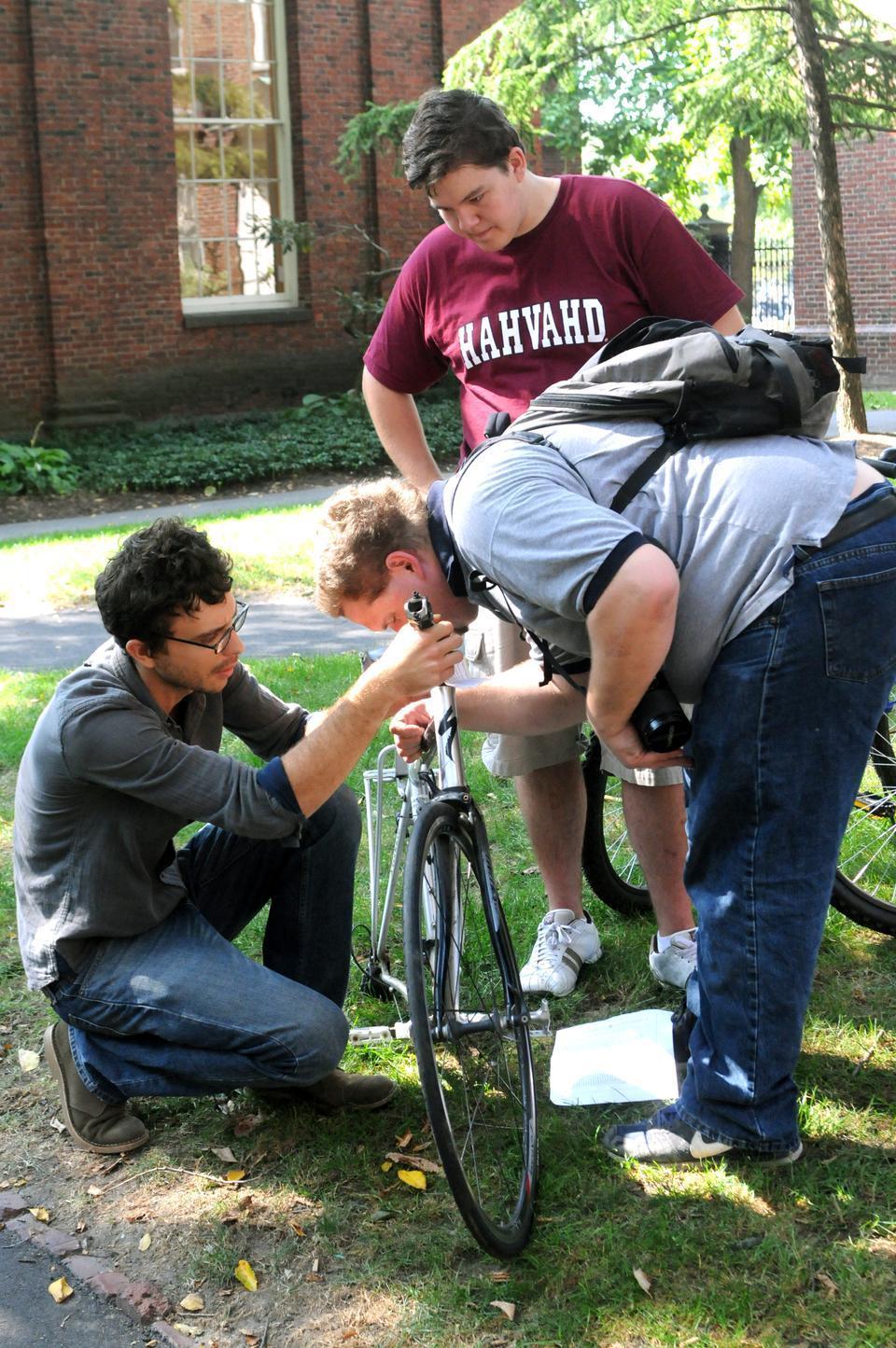 Harvard's Phillips Brooks House Association hosted its annual bike auction on Saturday to raise money for its programs. Prospective bike owners arrived early to examine the bikes' conditions prior to the bidding.