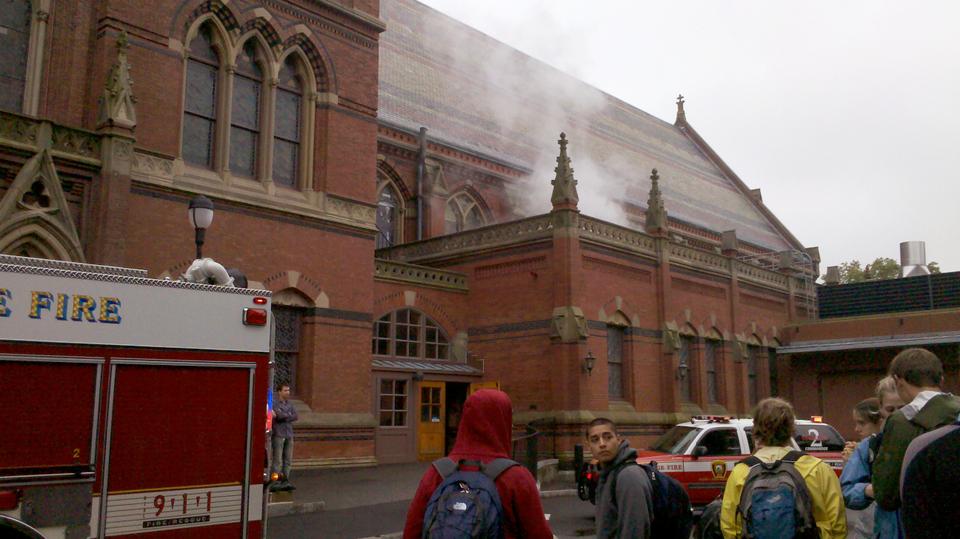 Students watch the smoke rising from the back of Memorial Hall yesterday.