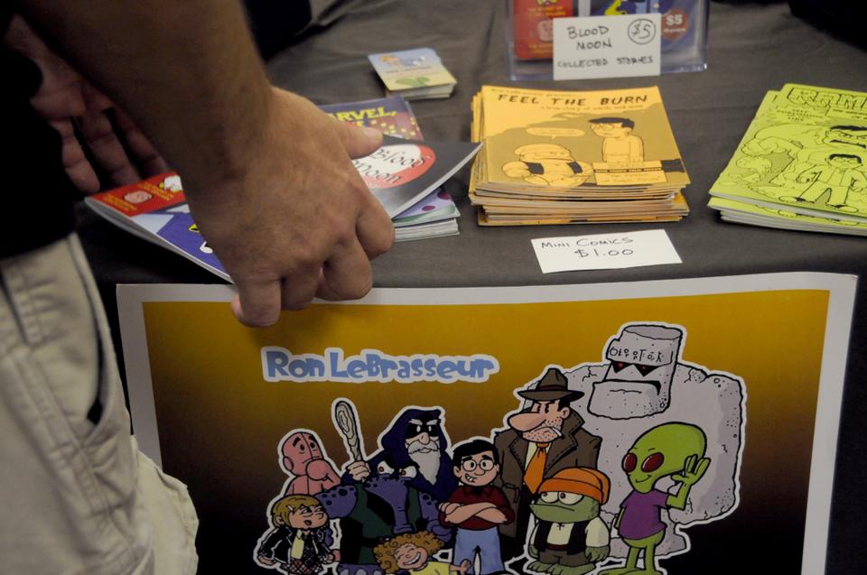 Ron LeBrasseur, creator of several comic book series, set up an elaborate table showing all of his work, including his popular mini-comics, “Feel the Burn.”