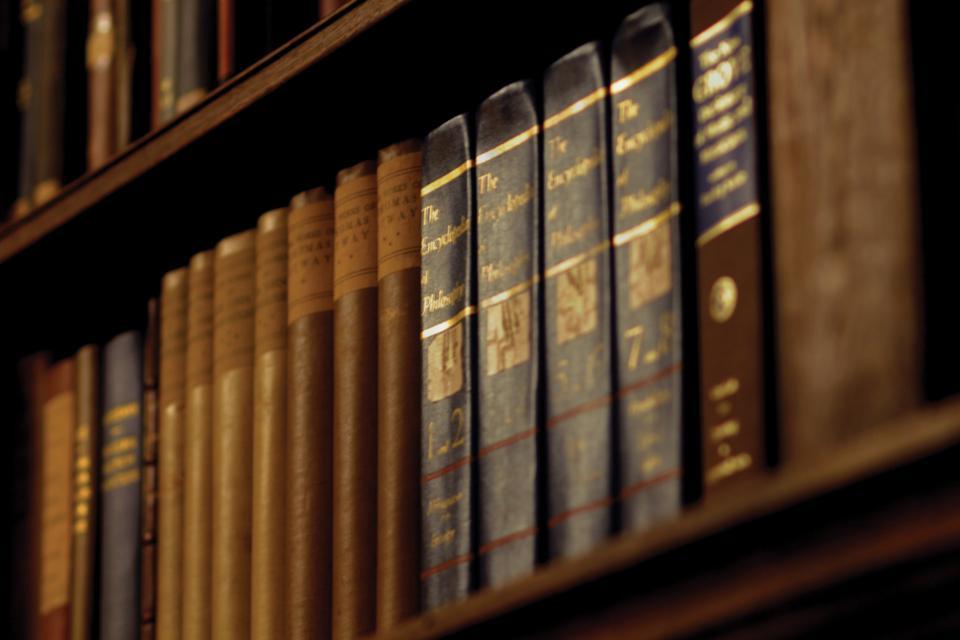 Books lining the Dunster Library shelves are no longer protected behind metal bars installed last year to preventing students from moving them.