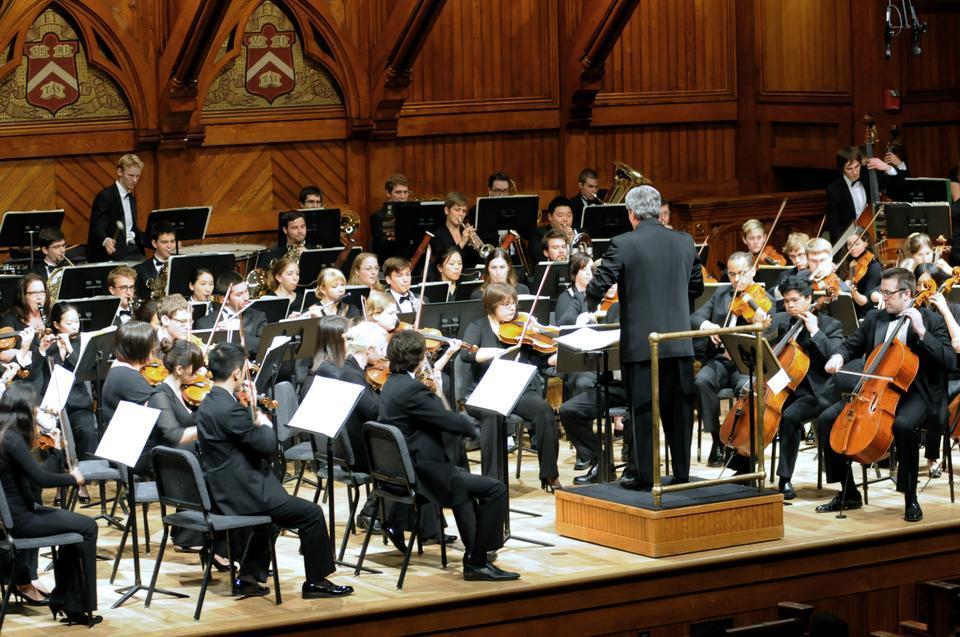 Bruce Hangen conducts the Boston Conservatory Orchestra in a performance of Debussy’s “Iberia” in Sanders Theater, Memorial Hall on Sunday afternoon.