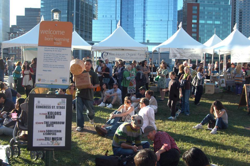 Boston residents gather on the Boston waterfront Saturday afternoon to enjoy locally prepared food, a farmer’s market, and live music at the Boston Local Food Festival.