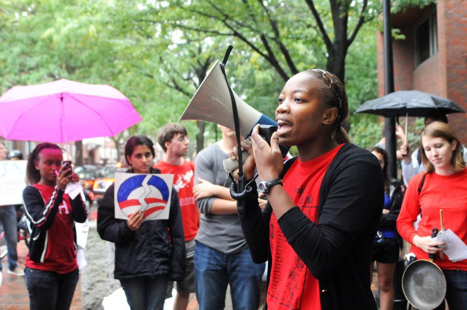Harvard undergraduate and graduate students advocate for a $5 billion increase in PEPFAR funds at the Rally to Fight AIDS organized by the Global Health and AIDS Coalition last Friday outside the Kennedy School of Government.