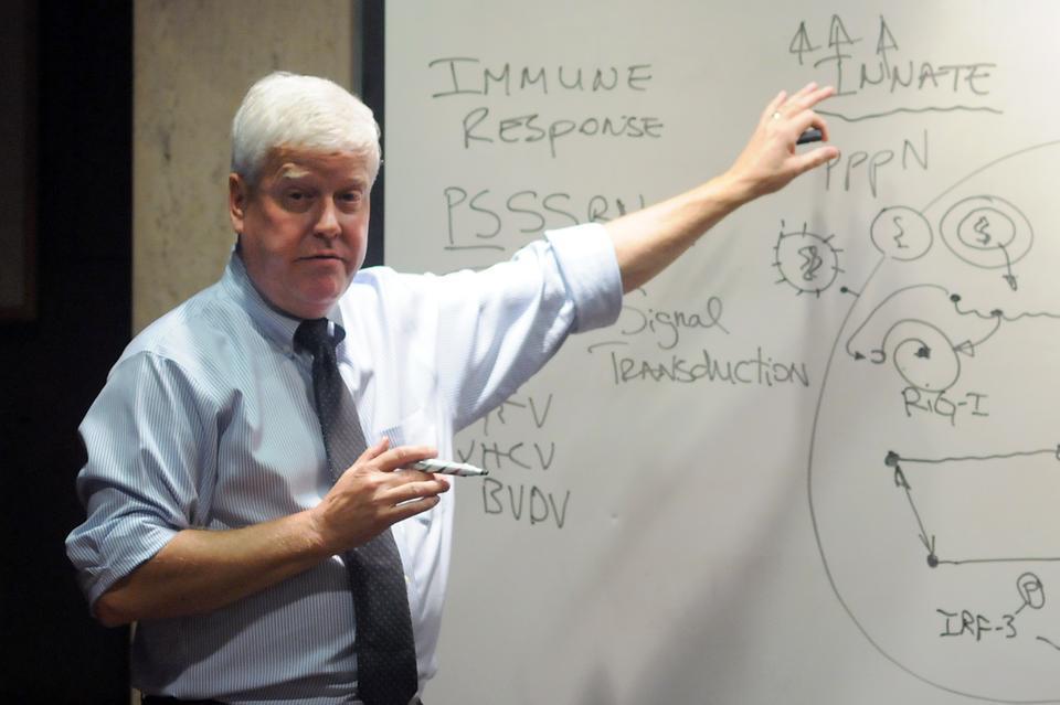 Quincy House Master and HMS Professor Lee Gehrke speaks to students in his house last night about his life path that started in rural Illinois, about his work with Dengue Virus, and his time at Harvard.