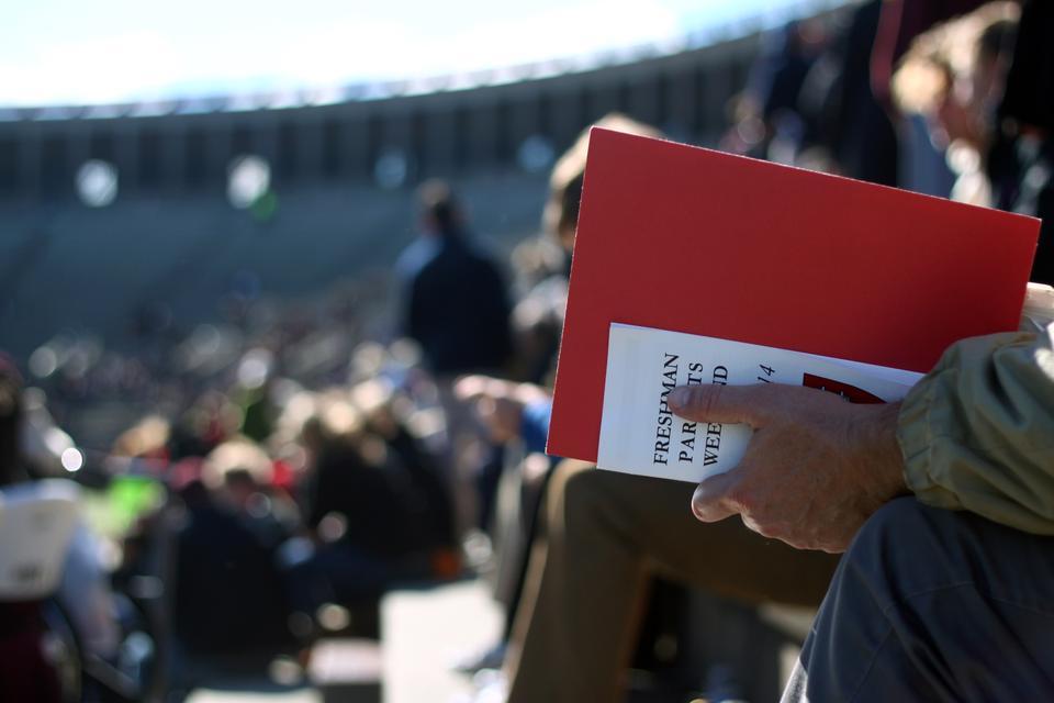 Parents of freshmen watch the football game on Saturday. Parents from all over the world flocked to Cambridge this week to see what their kids are experiencing during their first year at Harvard. 