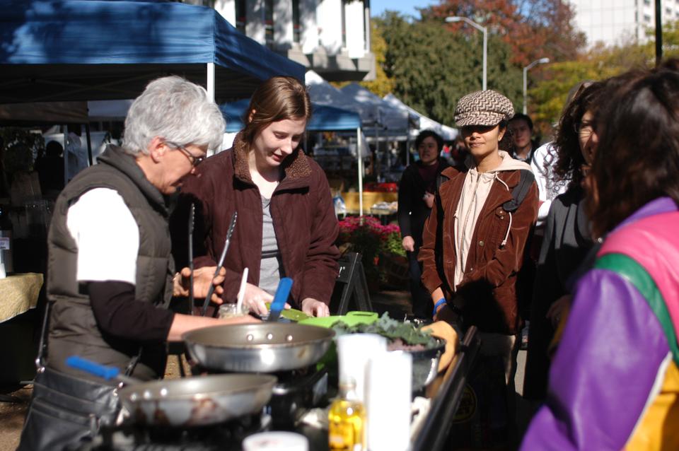 Market visitors wait in line to sample food at the Farmers’ Market at Harvard, which runs every Tuesday from 12:30 to 6 p.m. through Oct. 26 at the lawn between the Science Center and Memorial Hall. Fresh, locally grown produce, baked goods, cheese, maple syrup, chocolate, and flowers are sold. 
