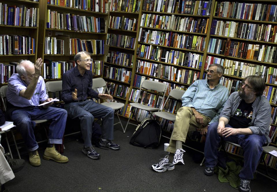 Leonard Katz, second on the left, elaborates on his ideas of the errors, problems, and benefits of using folk psychology as a tool to understand human behavior and beliefs. Tom Canel '83, far right, and Kiril Sinkel led a discussion on folk psychology hosted by The Philosophy Cafe at The Harvard Book Store yesterday night.