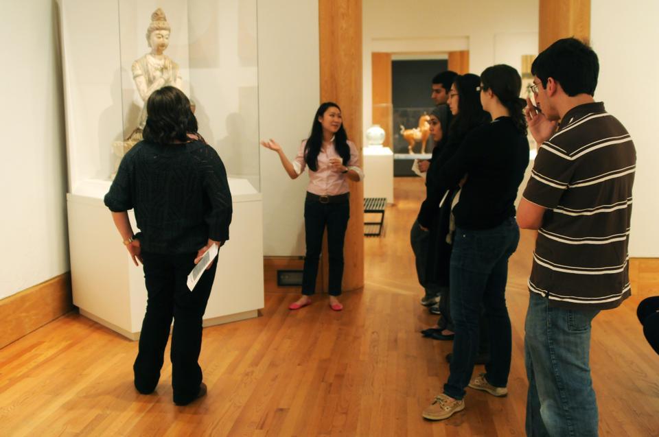 Nancy Lin '11 gives a tour called "Kings and Gods: Important Statues across Cultures." This particular exhibit is of a Buddha in the Asian and Islamic Art (5000BC to the present) section, as one of several student-led tours of the Sackler Museum.