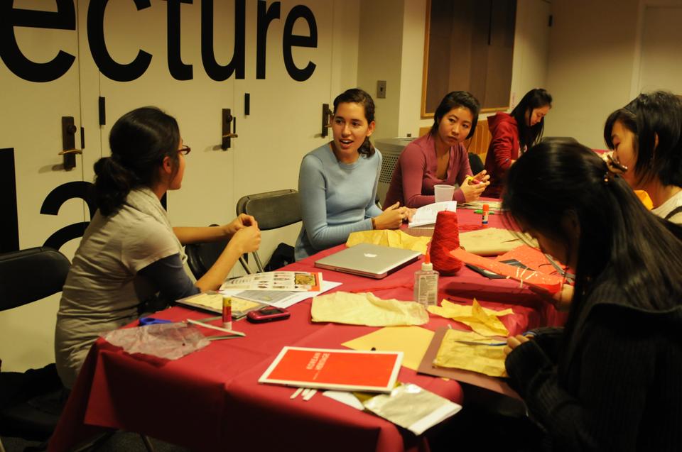 The Harvard Art Society holds an art making event in the basement of the Sackler museum. They used old books and magazines to make collages. (Second and third from left, co-presidents Leah Schecter '13 and Milo Tong '12)