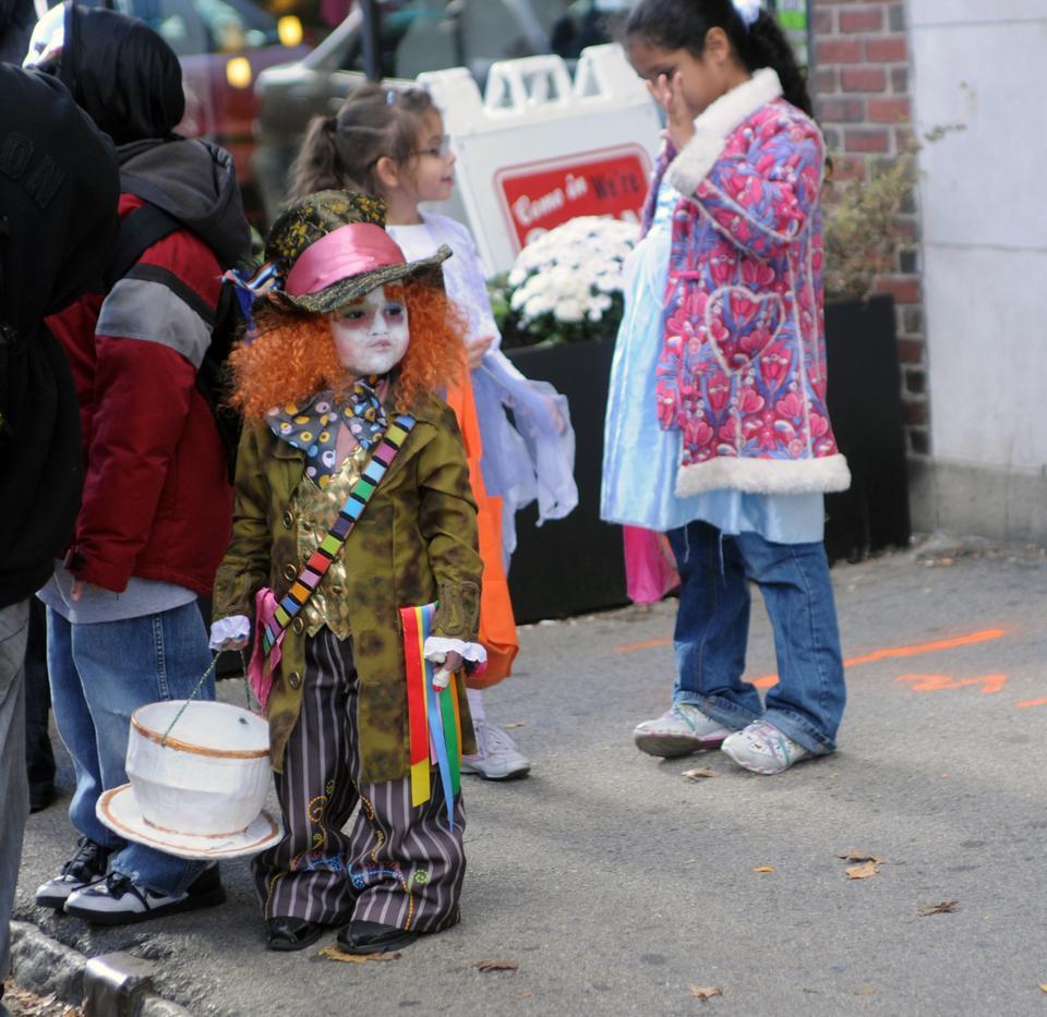 Children dress up as clowns, princesses and fairies on JFK street yesterday in preparation for trick-or-treating in the evening.  One child masquerades as the Mad Hatter from Alice in Wonderland.