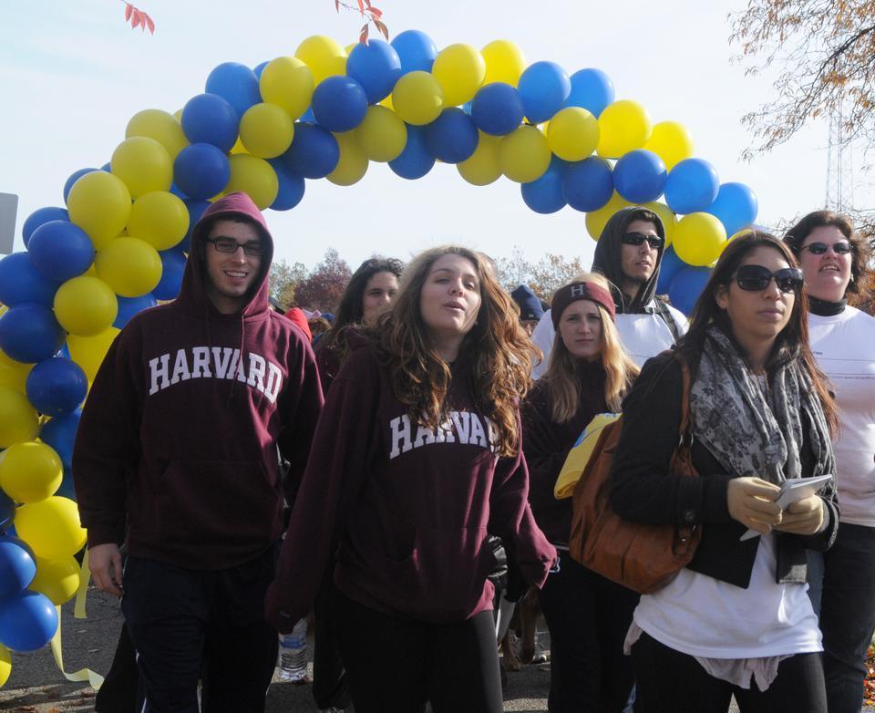 Matthew Devino '13, Anna Gommerstadt '12, Emma Wood '12, and Ellen Farber '13 walk as part of the Team Crimson in the Boston VisionWalk event at Artesani Park Saturday morning, an annual event hosted by the Foundation Fighting Blindness to raise money for research for eye diseases. 