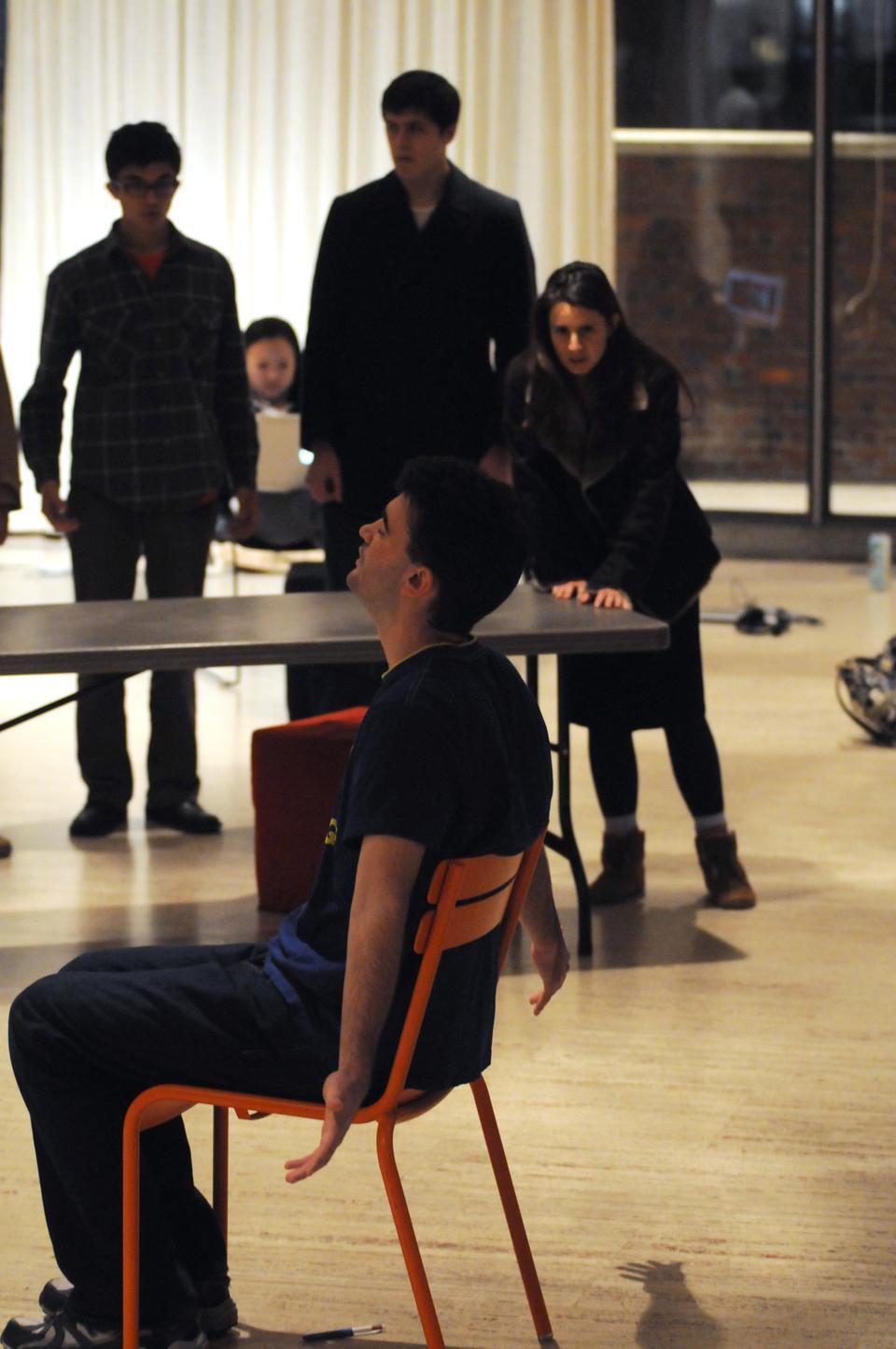 Irma (Maria-Ilinca Radulian ’11) argues with the Chief of Police (Daniel J. Giles ’13) during a rehearsal for The Balcony.