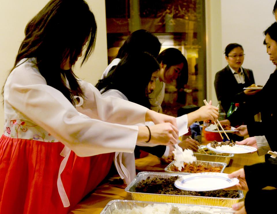 Hungry Chuseok celebration attendees were served Korean foods such as rice, kimchi (spicy pickled vegetables), bulgogi (marinated beef) and pajun (korean pancake). 
