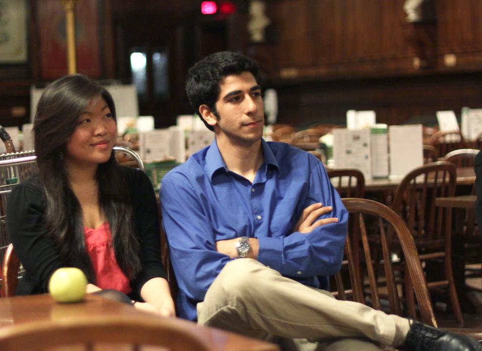 Senan Ebrahim ’12 (right) and his vice presidential candidate Bonnie Cao ’12 listen during a UC presidential debate held last night in Annenberg. 