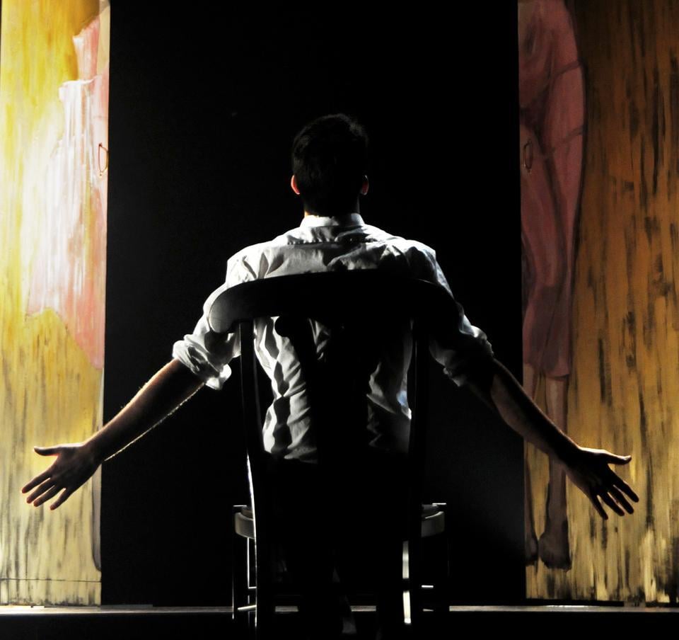 Dan J. Giles ’13, as Chief of Police, locks himself in a mausoleum in the final scene of the Mainstage’s “The Balcony.”