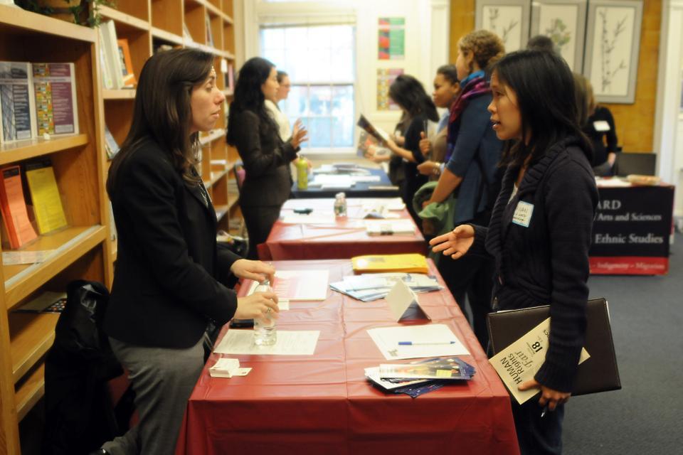 Students talk to representatives from human rights organizations like the Peace Corps, Amnesty International, and Harvard College AIESEC, at the Human Rights Fair yesterday. Seventeen local, national, and international human rights organizations were represented at the event, which was held yesterday afternoon at the Office of Career Services.