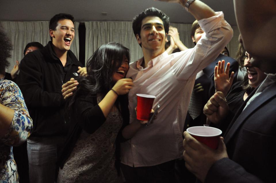 Senan Ebrahim ‘12 and Bonnie Cao ‘12 celebrate at their campaign headquarters in New Quincy after receiving news that they had won the election for the President and Vice President of the Undergraduate Council last night.