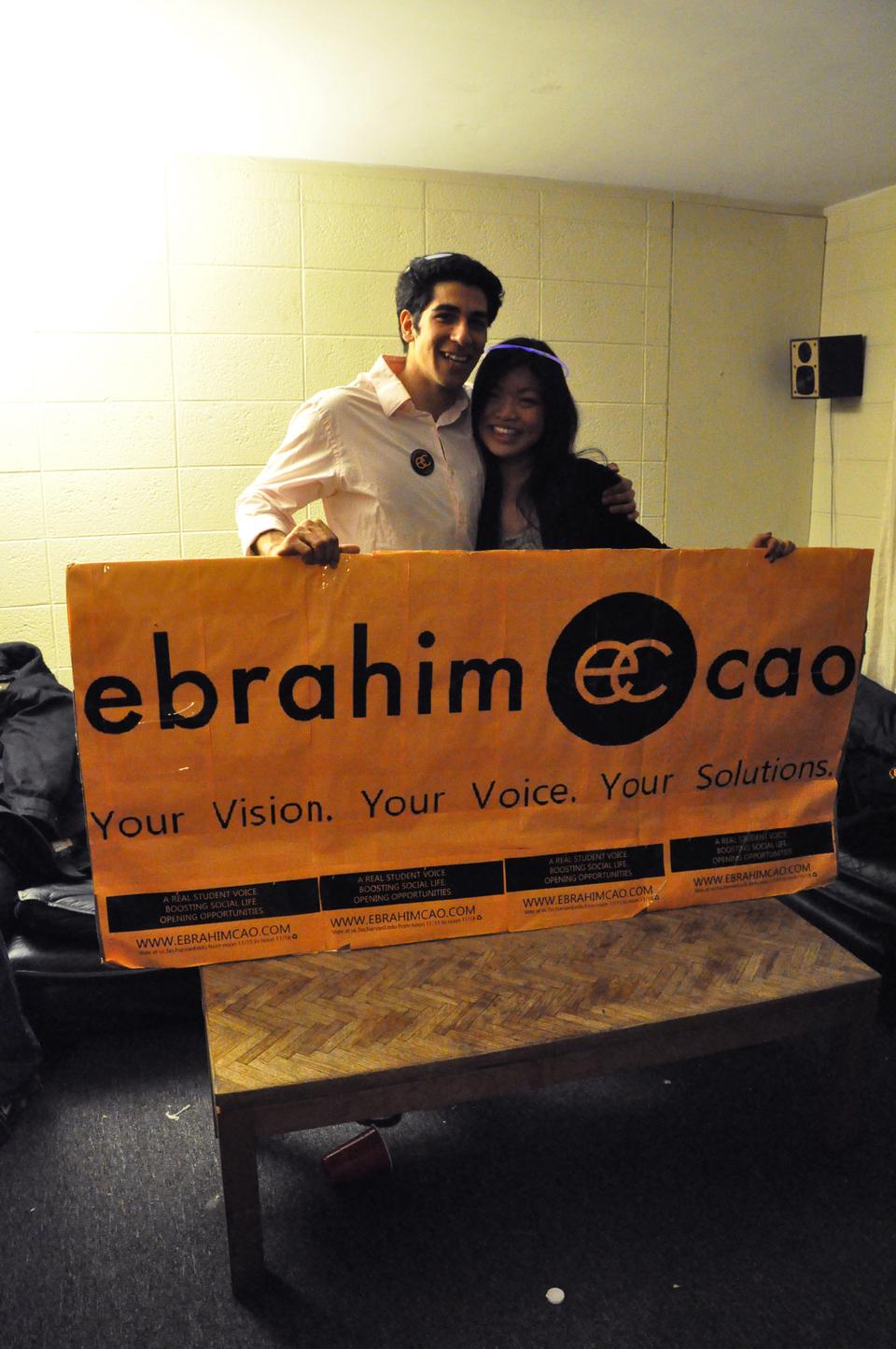 Senan Ebrahim ‘12 and Bonnie Cao ‘12 pose behind their campain poster after winning the UC election.
