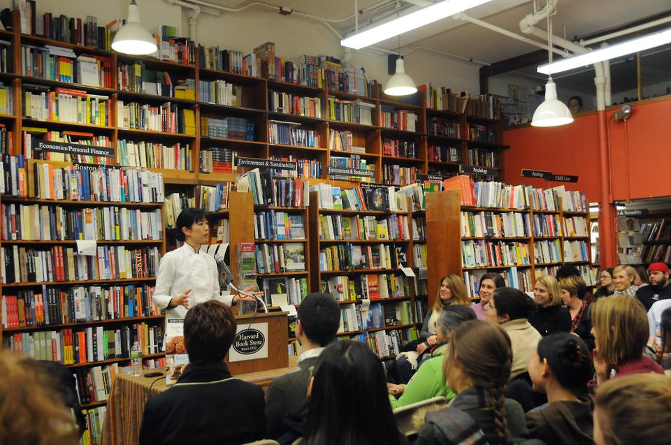 Joanne Chang '91, the founder of Flour Bakery and Cafe, speaks to a crowd at the Harvard Bookstore about her entry into the culinary business and her recently published cookbook