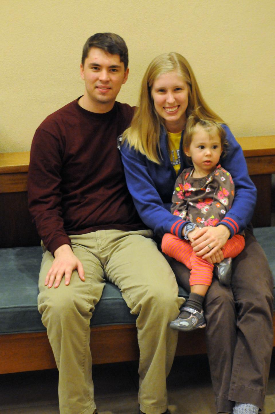 The McGinnisses are both undergraduates, he at Harvard and she at Wellesley. The couple takes a break from studying for final exams to play with their two year old daughter, Sophie.