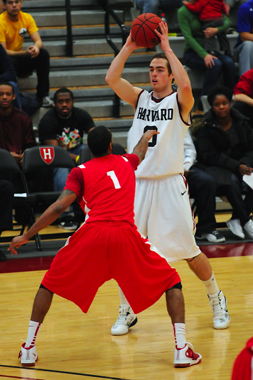Freshman Laurent Rivard, shown above in earlier action, led all scorers with 18 points in yesterday's matchup against Monmouth. Harvard pulled out a close win over the Hawks, 74-69. 