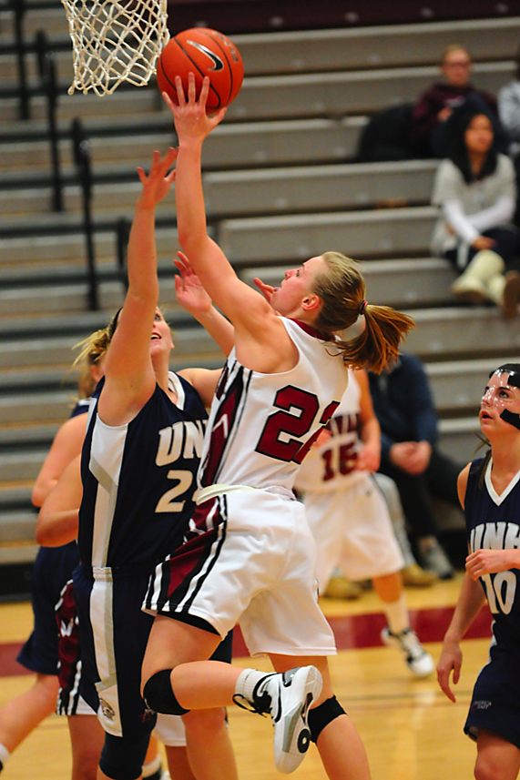 Harvard freshman Christine Clark, shown here in earlier action against UNH, was one of five players in double digits against Boston College. The Crimson lost the matchup, 80-78. 