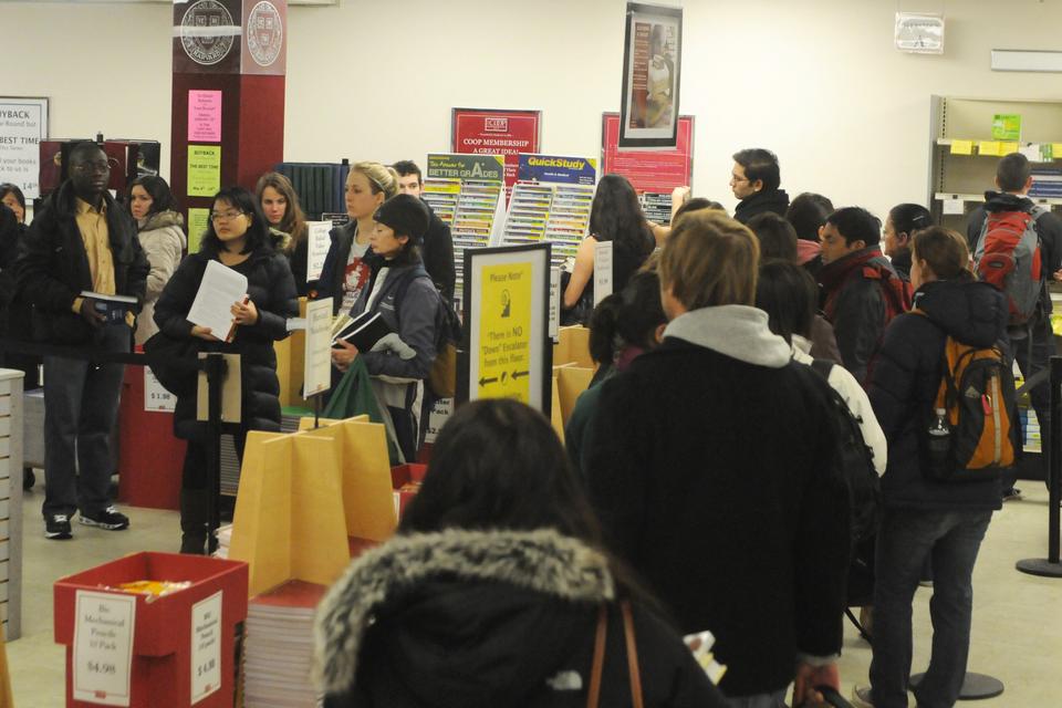 Students wait in line to purchase books at The Harvard Coop on Mass. Ave yesterday.  Lines formed throughout the store as classes ended on the second day of shopping period.