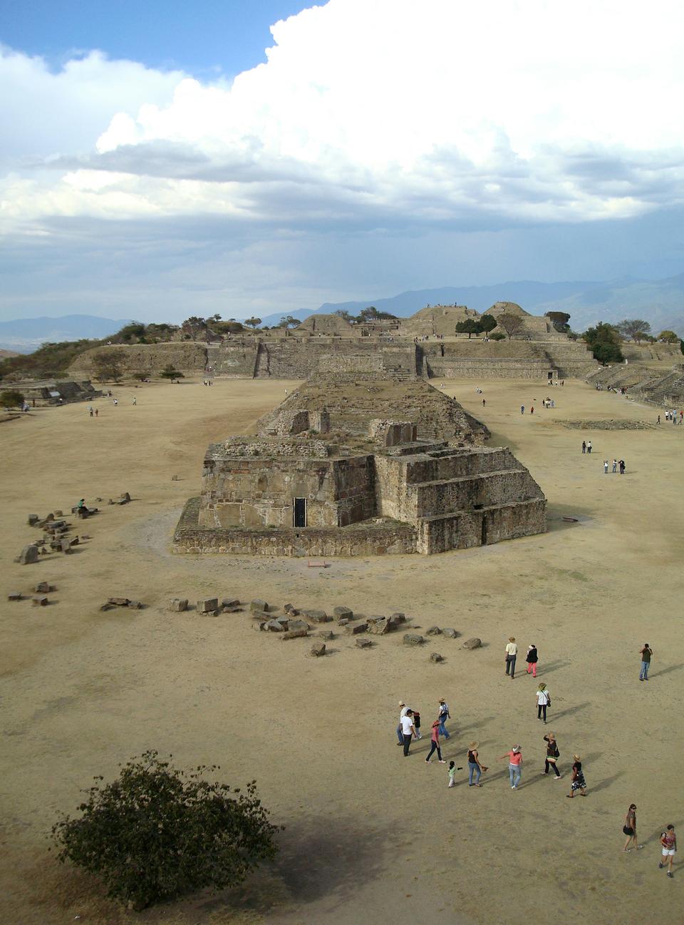 Tourists walk among the pyramids and temples of Monte Alban, a pre-Columbian ceremonial site in Oaxaca, Mexico on the first day of the New Year.