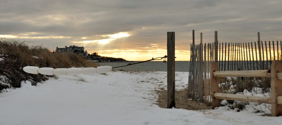 The sun sets on a snow-covered Woodneck Beach in Falmouth, Mass., in late December, 2010. Woodneck is one of ten public beaches in the upper Cape Cod town of approximately 32,000 year-round residents.