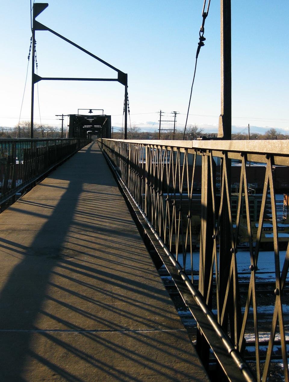 The bridge connecting East and West Laramie looms over the train tracks below.  The trains roll by every half hour or so, shaking the nearby downtown area.