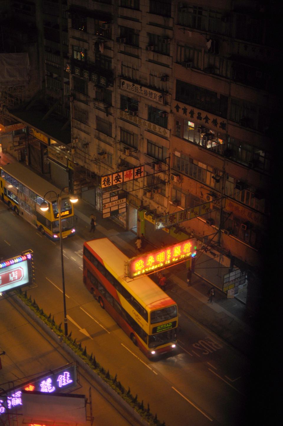 Close to midnight, when the shops begin to close near Yau Ma Tei Subway Station, people take public transportation home.