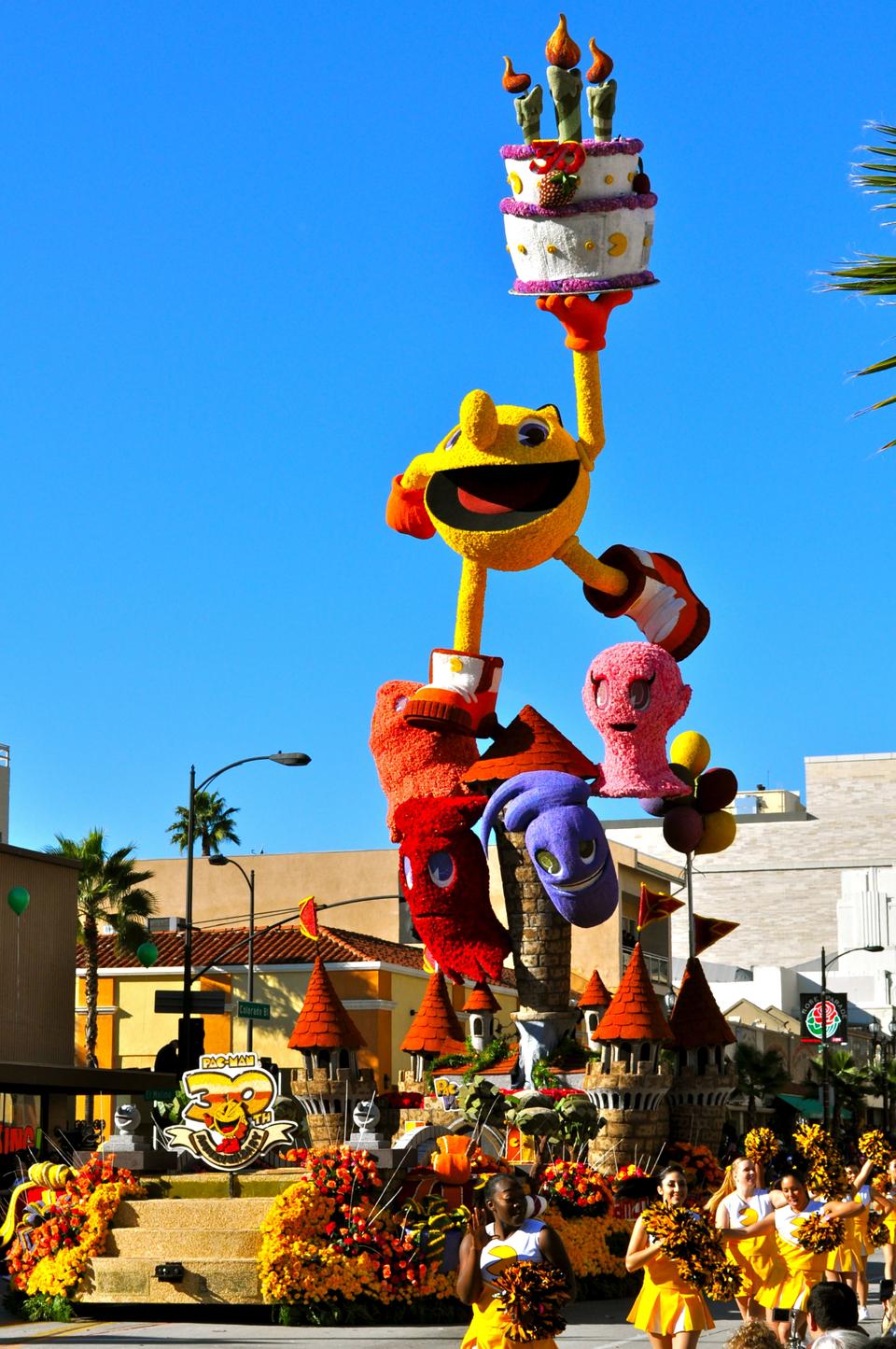 Pacman held his birthday cake up high while towering above spectators in Pasadena, CA.