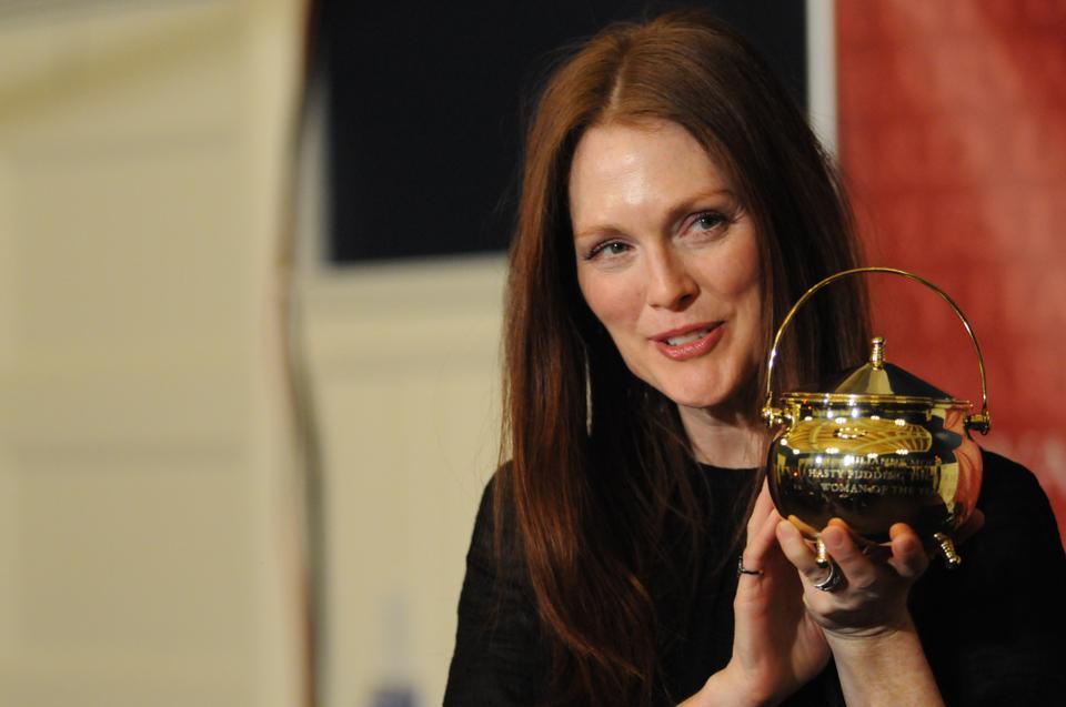 Hasty Pudding Woman of the Year Julianne Moore poses with her Pudding Pot during a press conference yesterday. Moore jokingly said that she would be storing her weed in the Pot. 