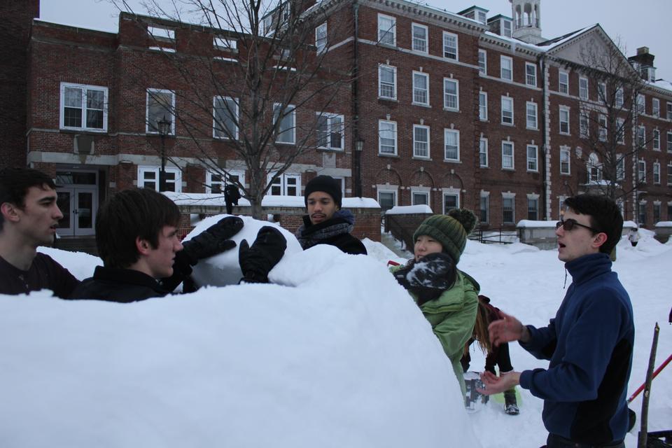 James E. Hawrot '12, Daniel K. Bruder '12, Romeo P. Alexander '11, Karen K.Y. Kim '13, and Alex T. Hristov '11 discuss how to start pitching the walls of the igloo inward.