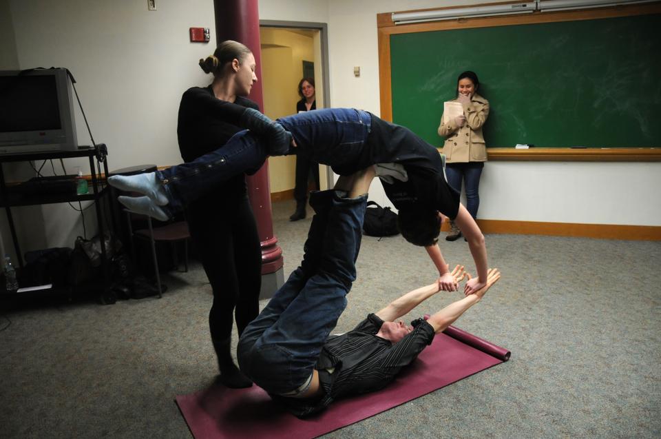 Sarina M. Patterson '14 (on top), Kobi A. Rex '14 (on bottom), and Marin J. Orlosky-Randow '08 (spotting them) participate in "A FAAB Affair" in the basement of Memorial Hall.
