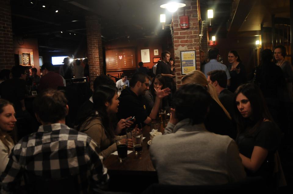 Members of the Harvard Immigration Project (HIP), a Law school student group advocating immigration law reform, hosts a happy hour at the Queen's Head Pub last night .