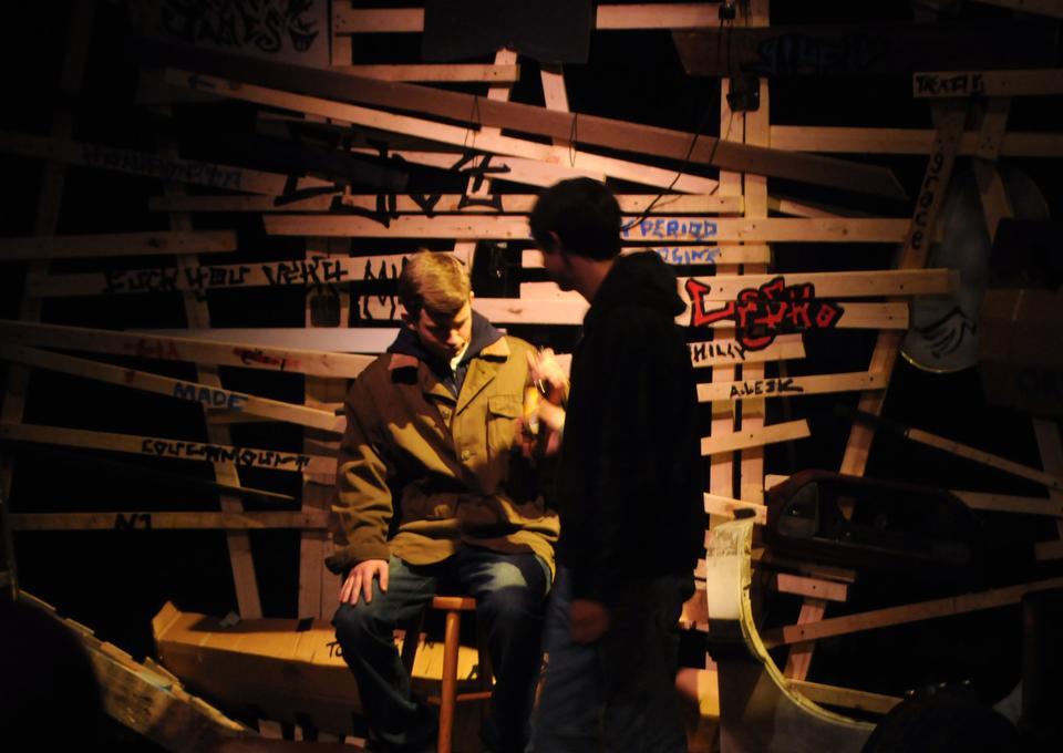 “Howie the Rookie” features only two actors and an elaborate backdrop of graffitied plywood and assorted detritus, meant to evoke Ireland’s less savory neighborhoods.
