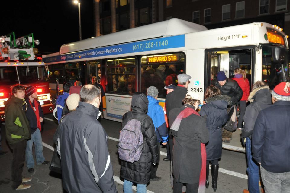Passengers waited at the Central Square station for bus shuttles to cover service following the closure of rail service due to a fatal collision.
